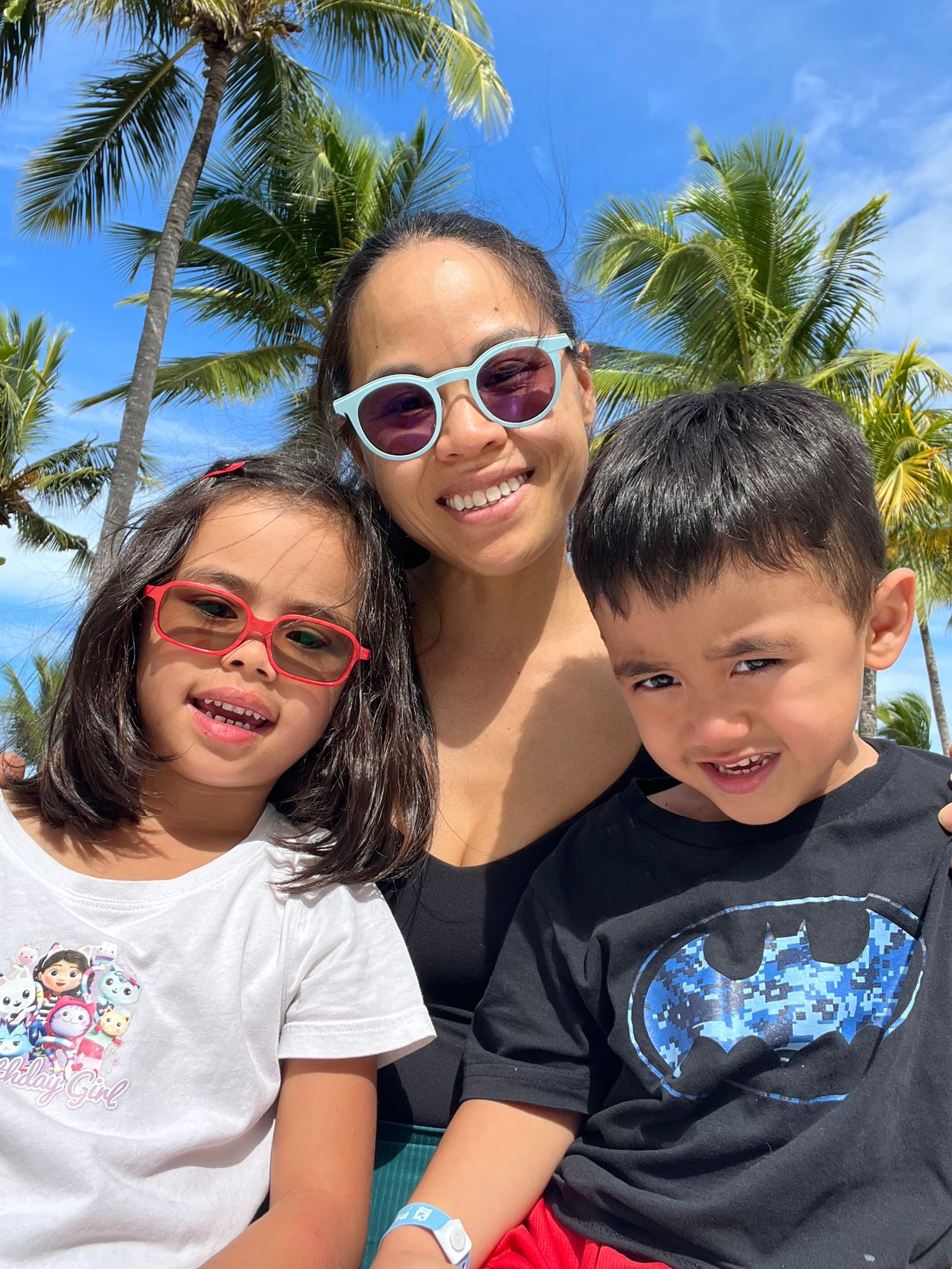 Dr. Sarah Fong with her two children on a sunny day