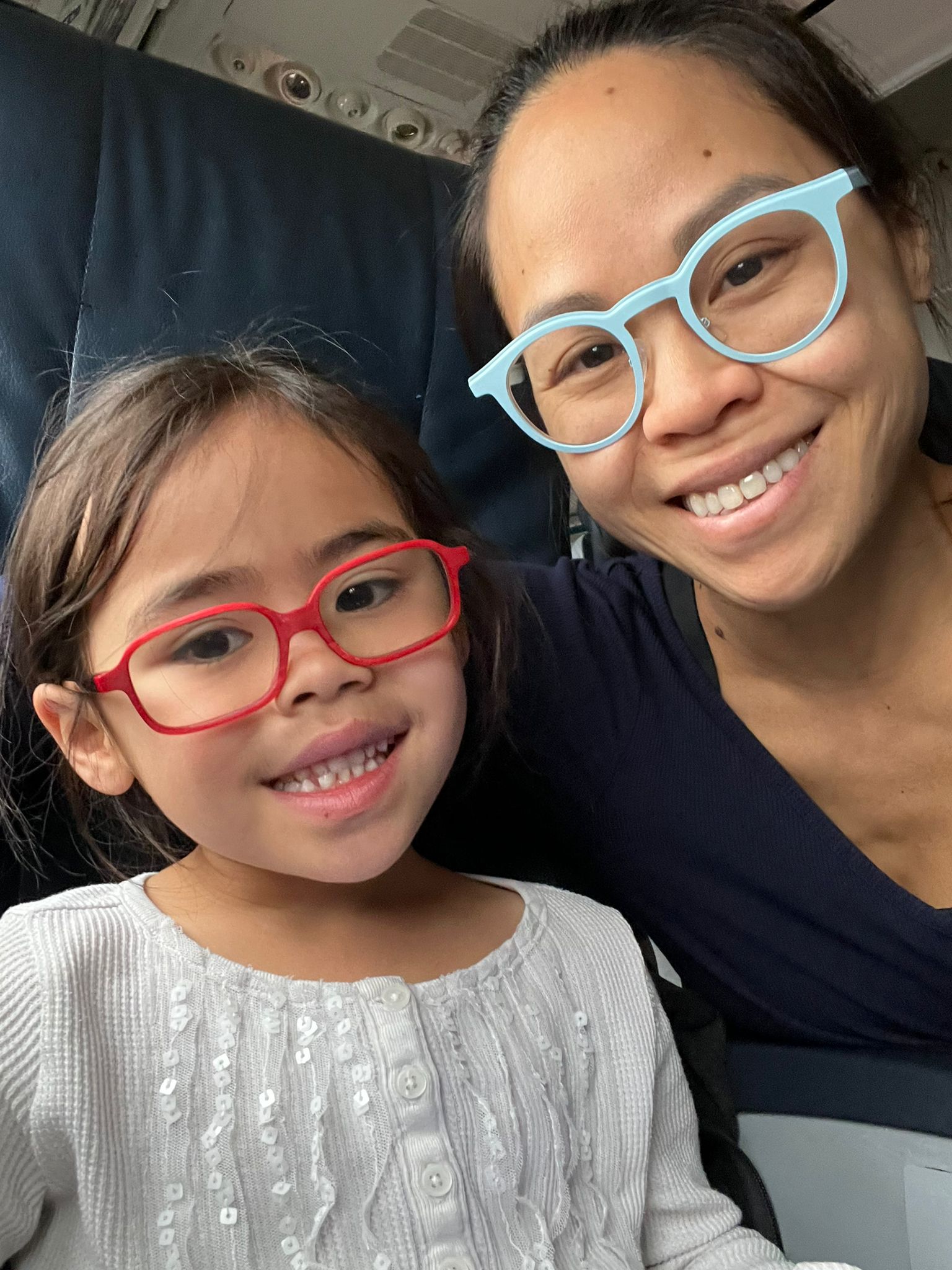 Dr. Sarah Fong with her daughter on a flight