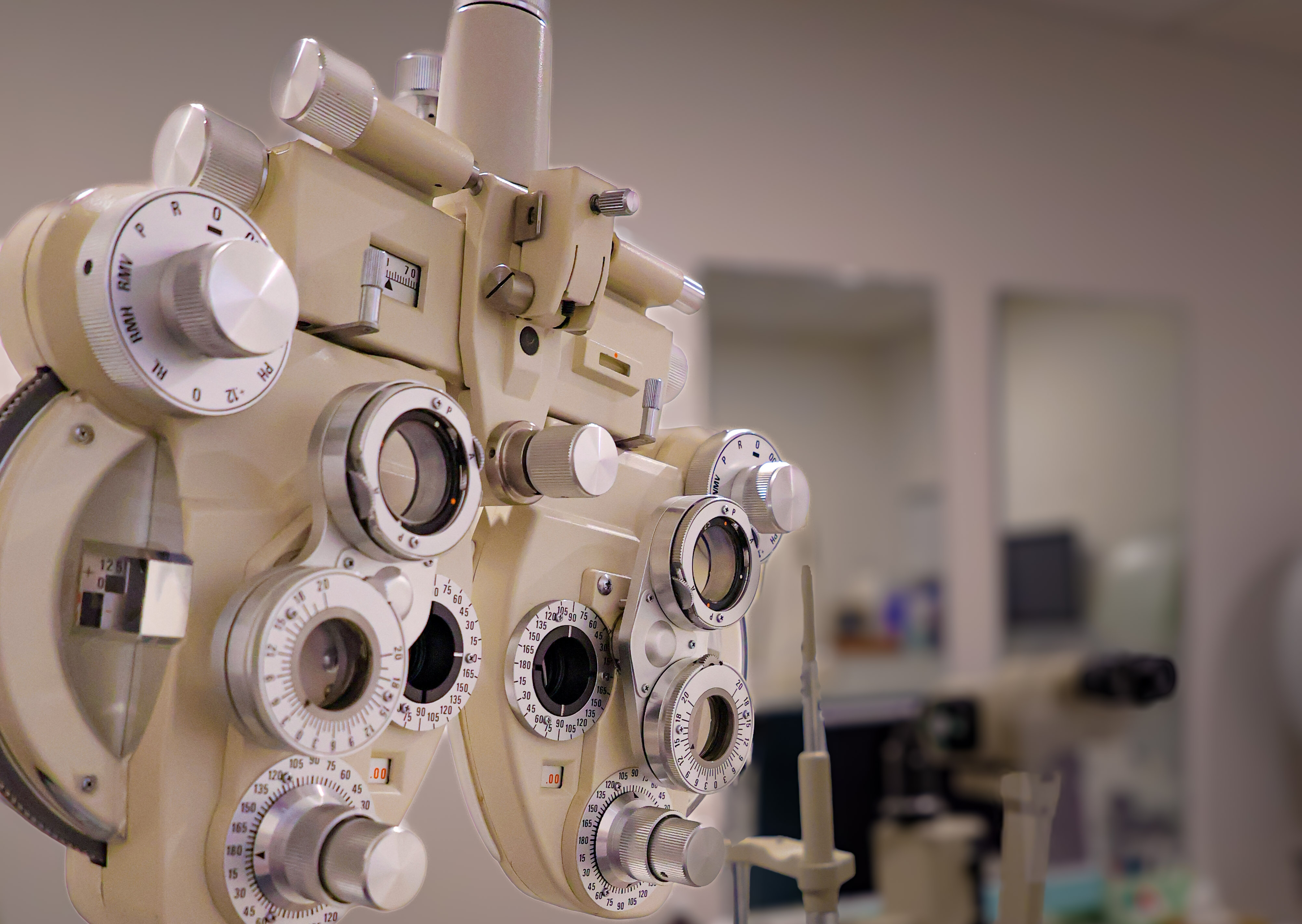 Phoropter and eye chart in an exam room at Boardwalk Eye Care, Cambridge